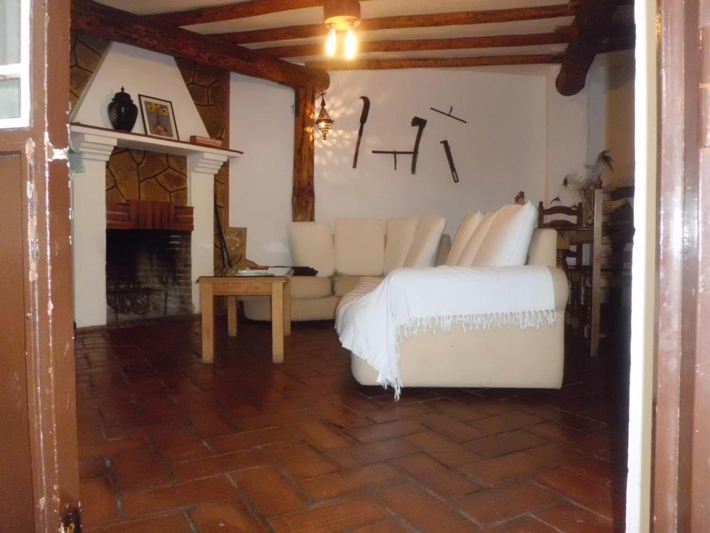 Łóżko lub łóżka w pokoju w obiekcie Apartamentos Jaronil