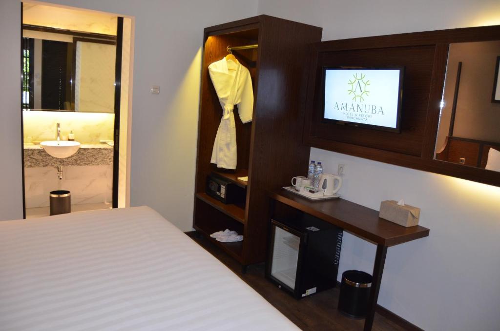 Postel nebo postele na pokoji v ubytování Amanuba Hotel & Resort Rancamaya