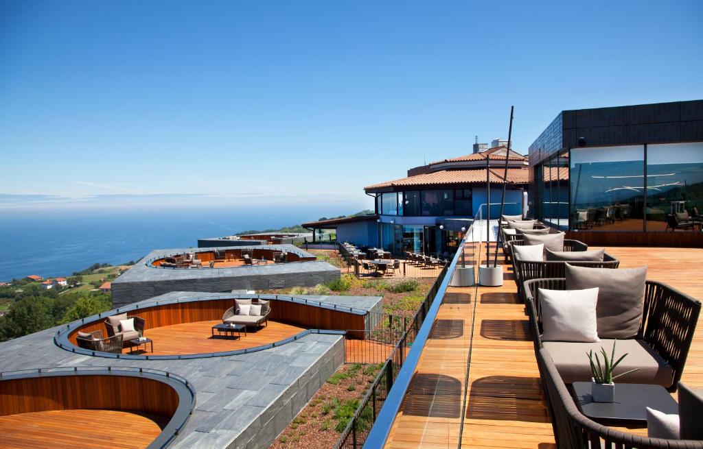 
a view from a balcony overlooking the ocean at Akelarre - Relais & Châteaux in San Sebastián
