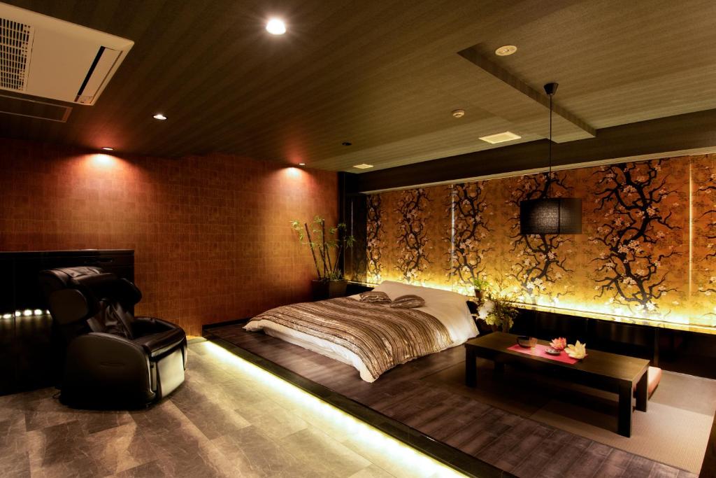 Postel nebo postele na pokoji v ubytování HOTEL Mai Sakura ADULT ONLY