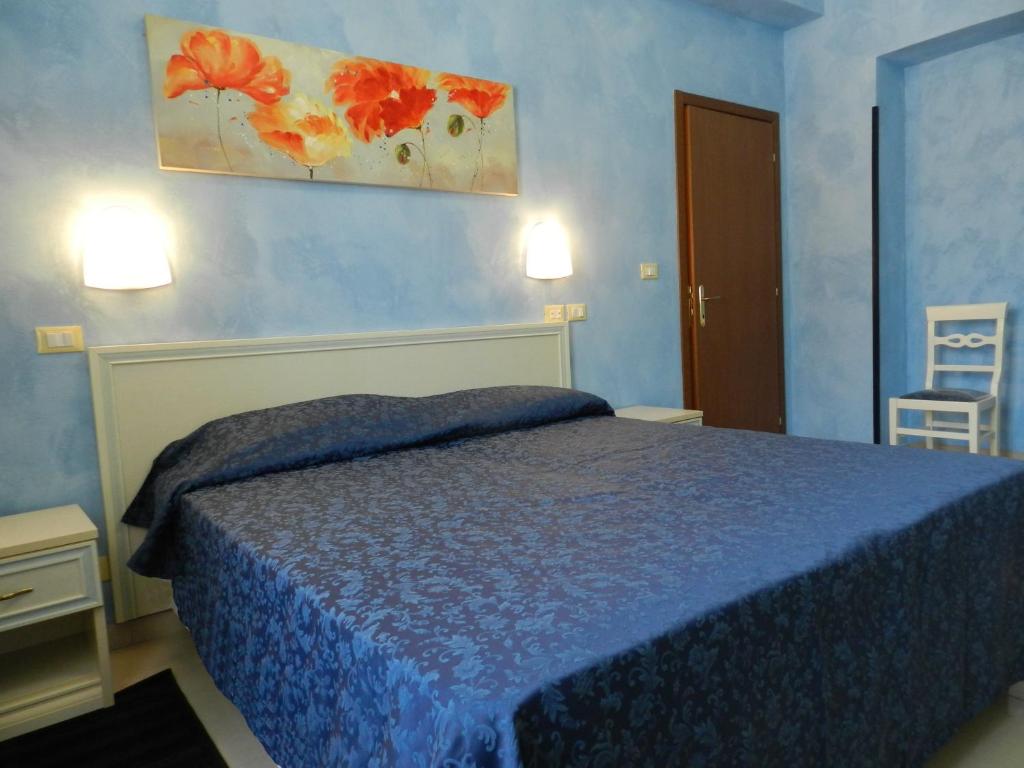 A bed or beds in a room at Hotel Air Palace Lingotto