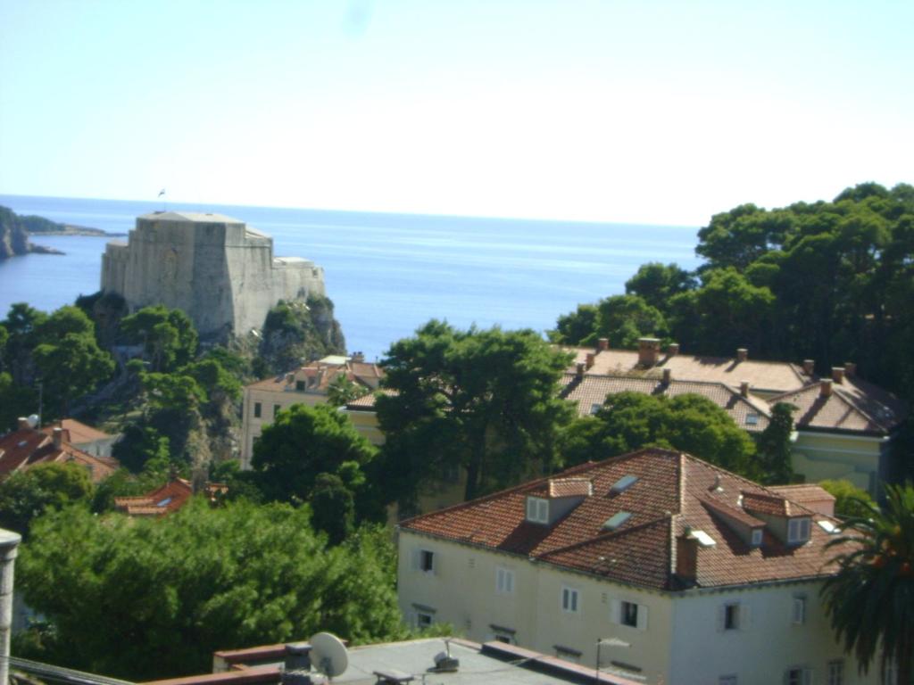 a view of a town with a castle and the ocean at Guest House Marijana in Dubrovnik