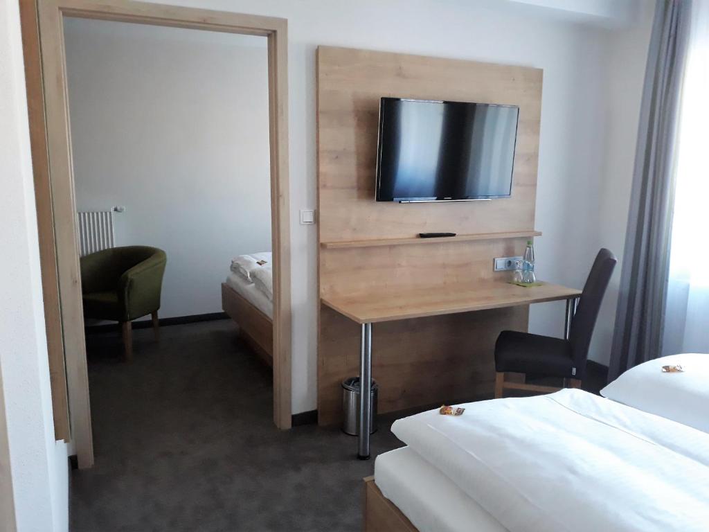 Postel nebo postele na pokoji v ubytování Gästehaus - Kretschmannshof