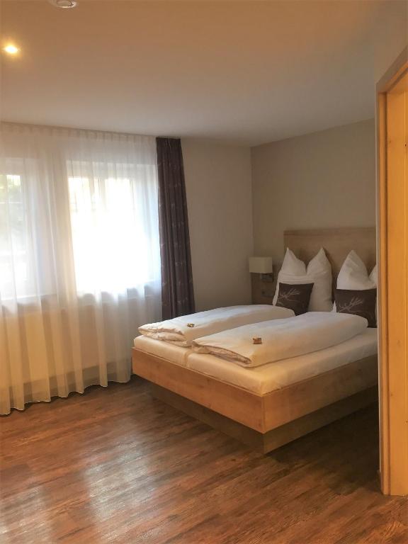 Postel nebo postele na pokoji v ubytování Gästehaus - Kretschmannshof