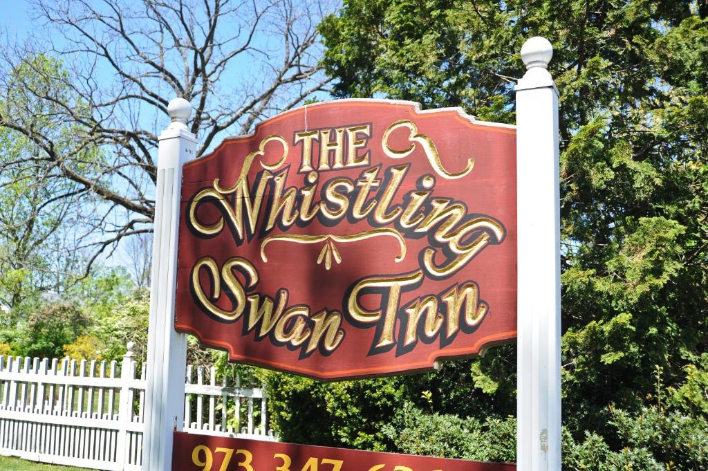 a sign for a walt disneys winter inn at Whistling Swan Inn in Stanhope