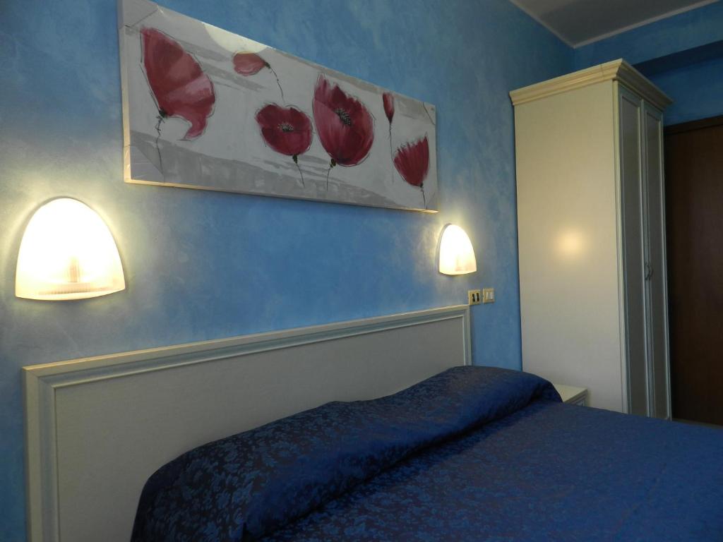 A bed or beds in a room at Hotel Air Palace Lingotto