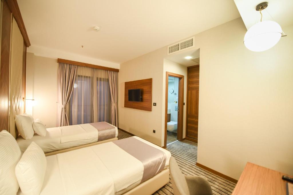 Postel nebo postele na pokoji v ubytování Hotel Union