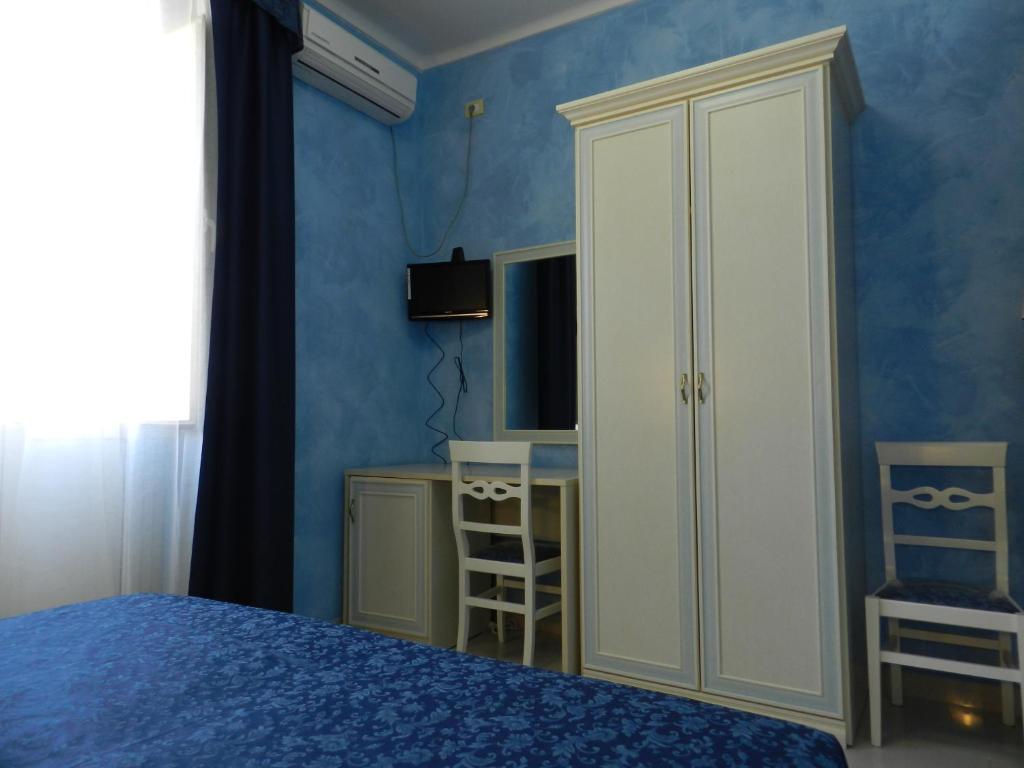 A bed or beds in a room at Hotel Air Palace Lingotto