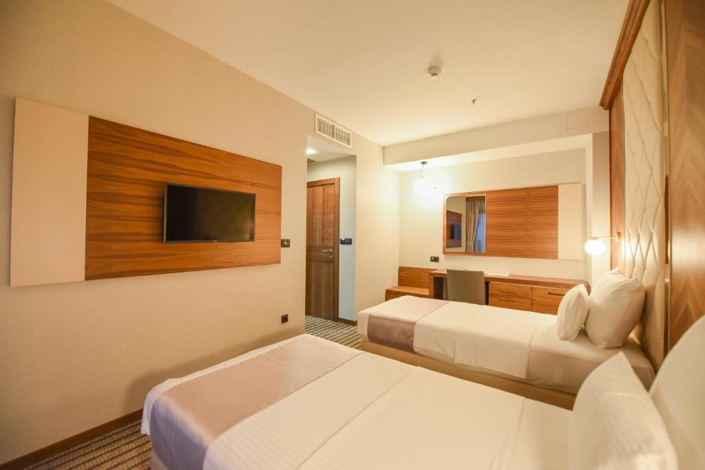 Postel nebo postele na pokoji v ubytování Hotel Union