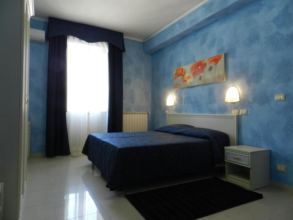A bed or beds in a room at Hotel Air Palace Lingotto