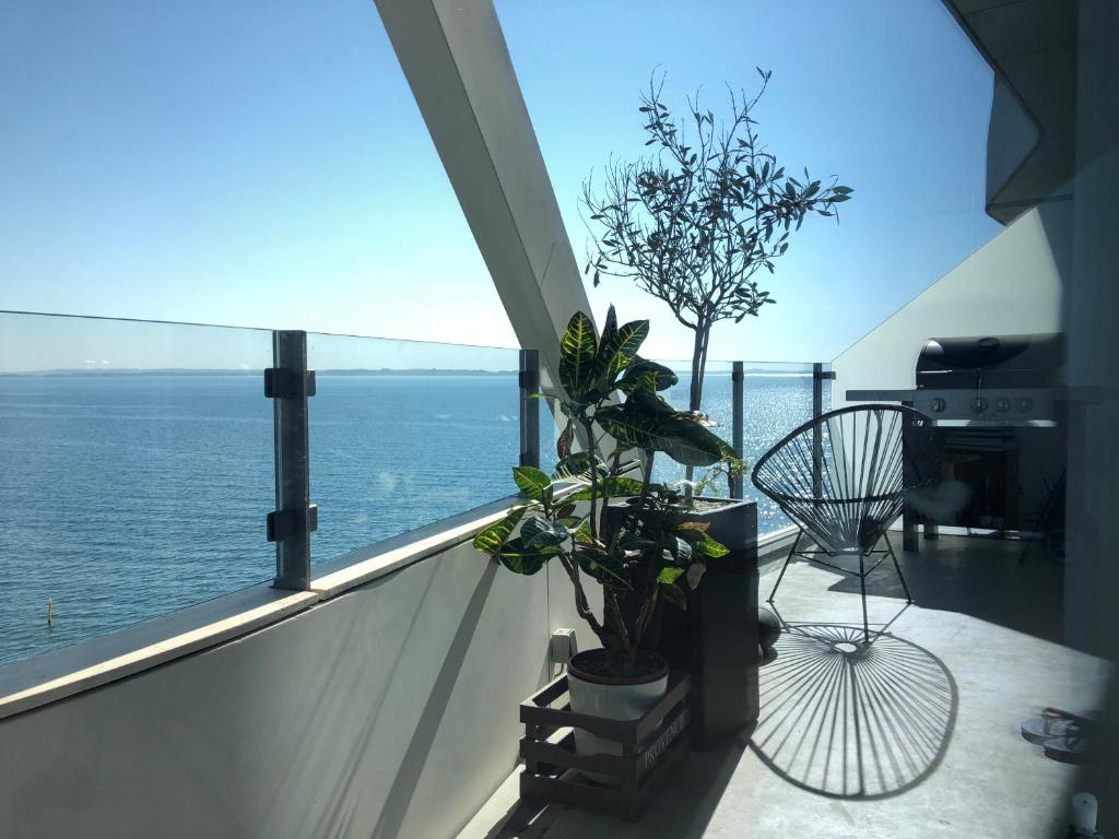 a balcony with a view of the ocean at Ocean View Apartment in Aarhus