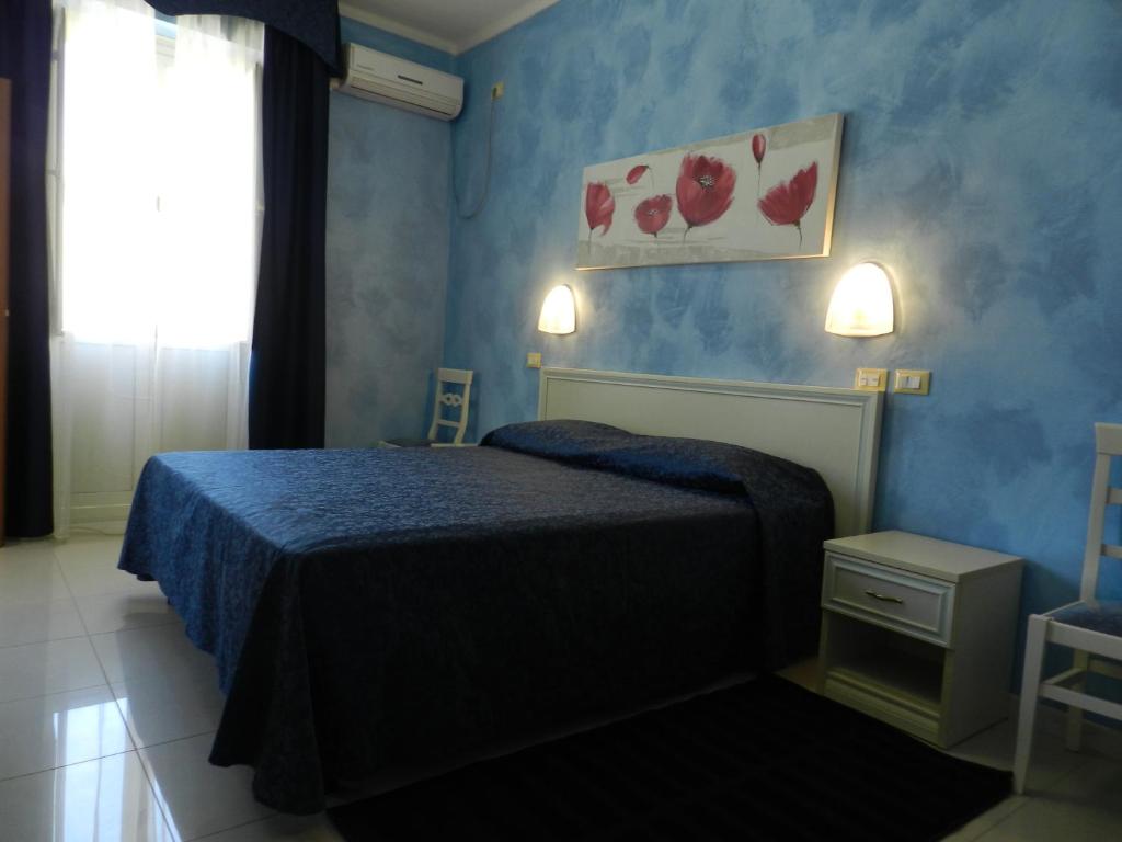 A bed or beds in a room at Hotel Air Palace Lingotto