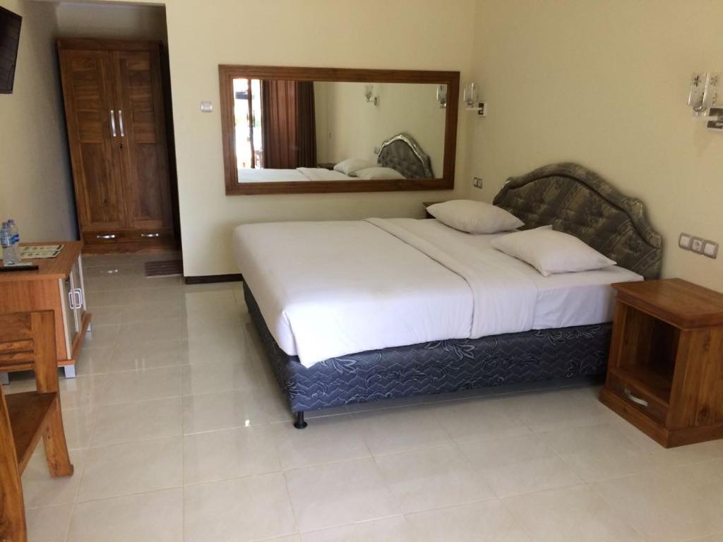 Voodi või voodid majutusasutuse Astina Hotel toas