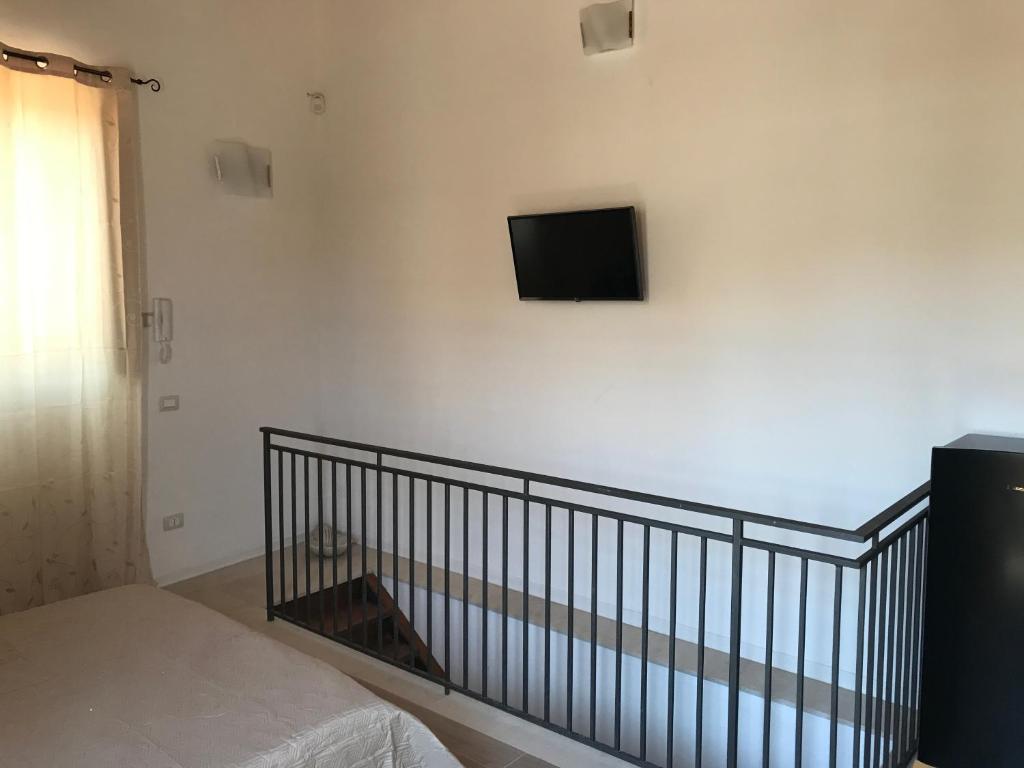 Postel nebo postele na pokoji v ubytování Decadracma rooms