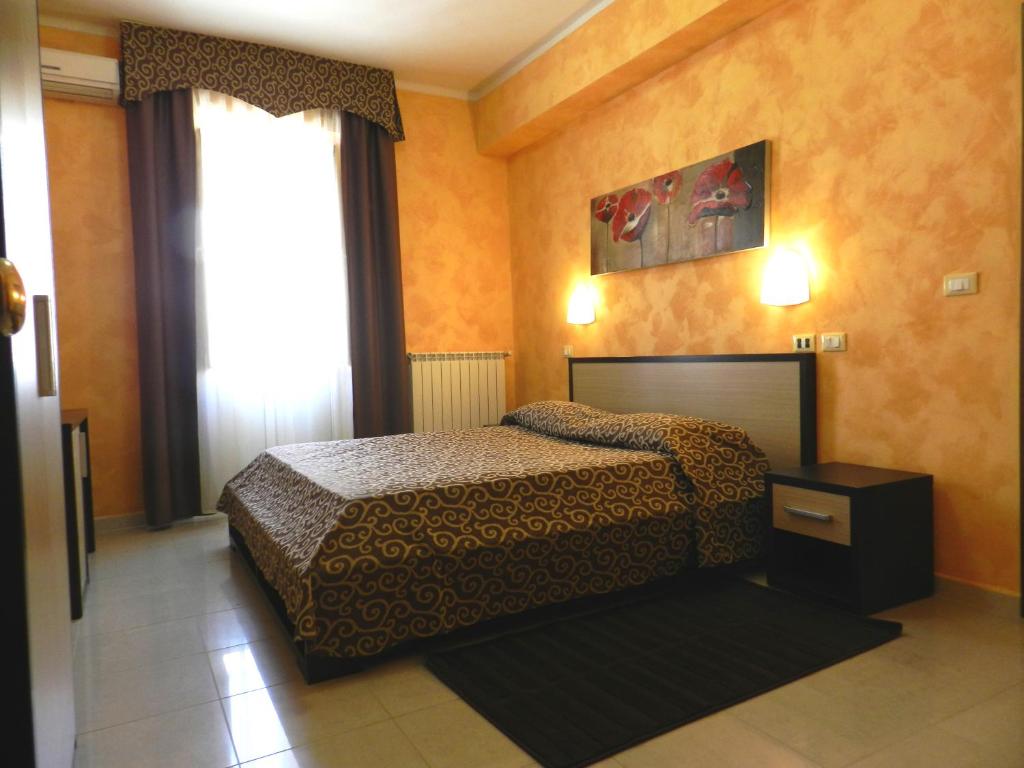 A bed or beds in a room at Hotel Air Palace Lingotto