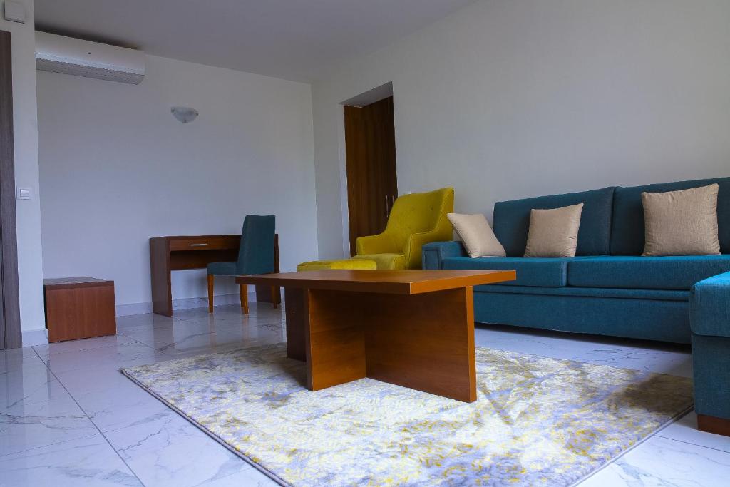 a living room with a couch and a table at Résidence ATTA in Abidjan