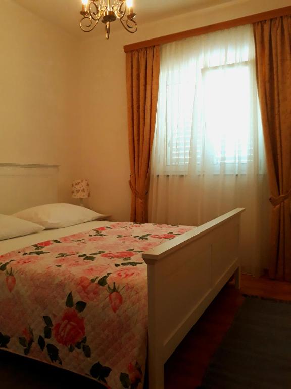 Postel nebo postele na pokoji v ubytování Apartments Vrisak