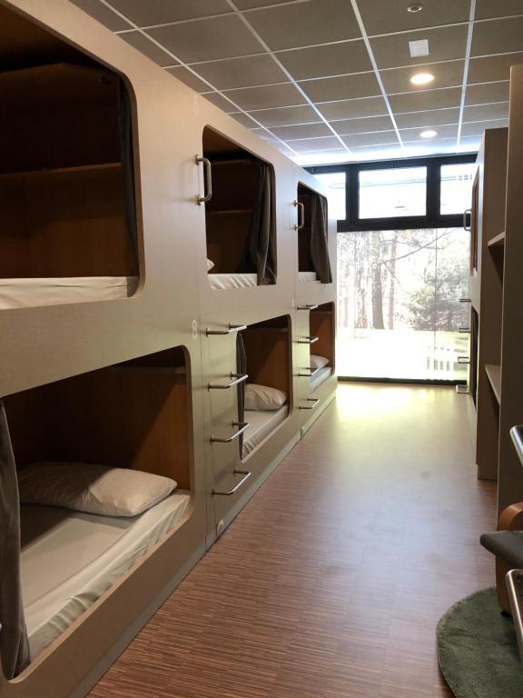 a room with bunk beds and a hallway at Andaina in Sarria