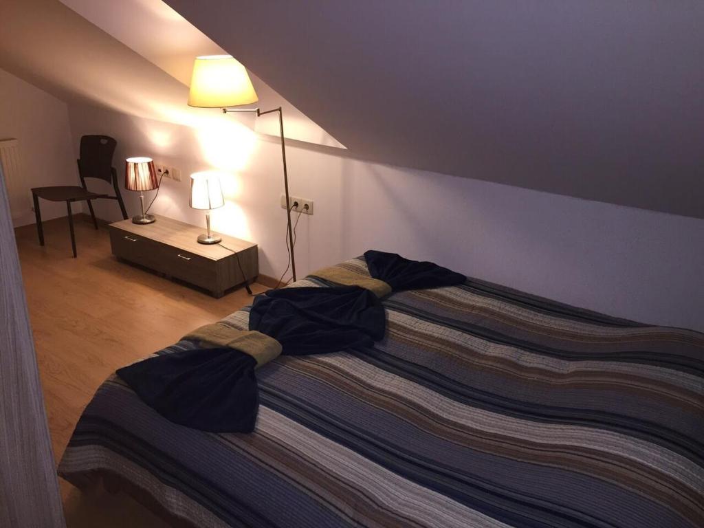 Postel nebo postele na pokoji v ubytování Apartment for 8 in New Gudauri