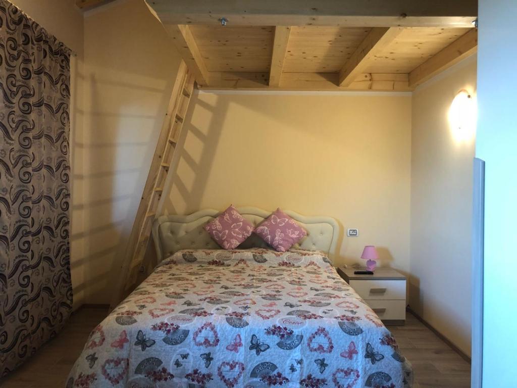 A bed or beds in a room at B&B Butterfly