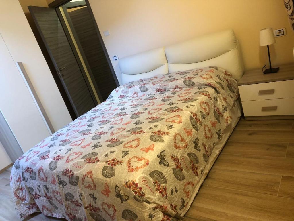 A bed or beds in a room at B&B Butterfly