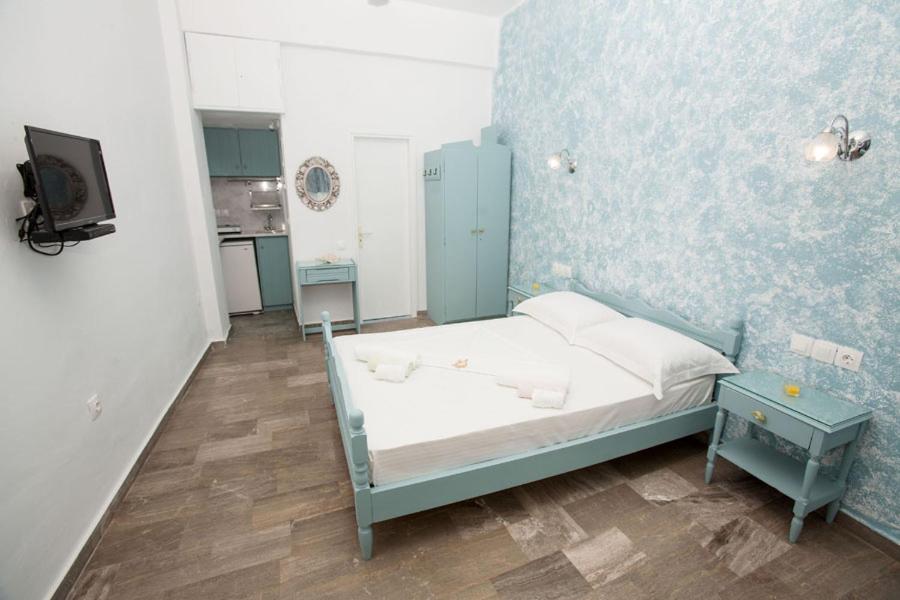 Postel nebo postele na pokoji v ubytování kyma studios