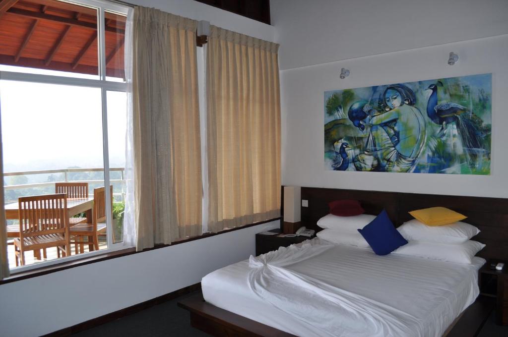 Postel nebo postele na pokoji v ubytování Amaara Sky Hotel Kandy