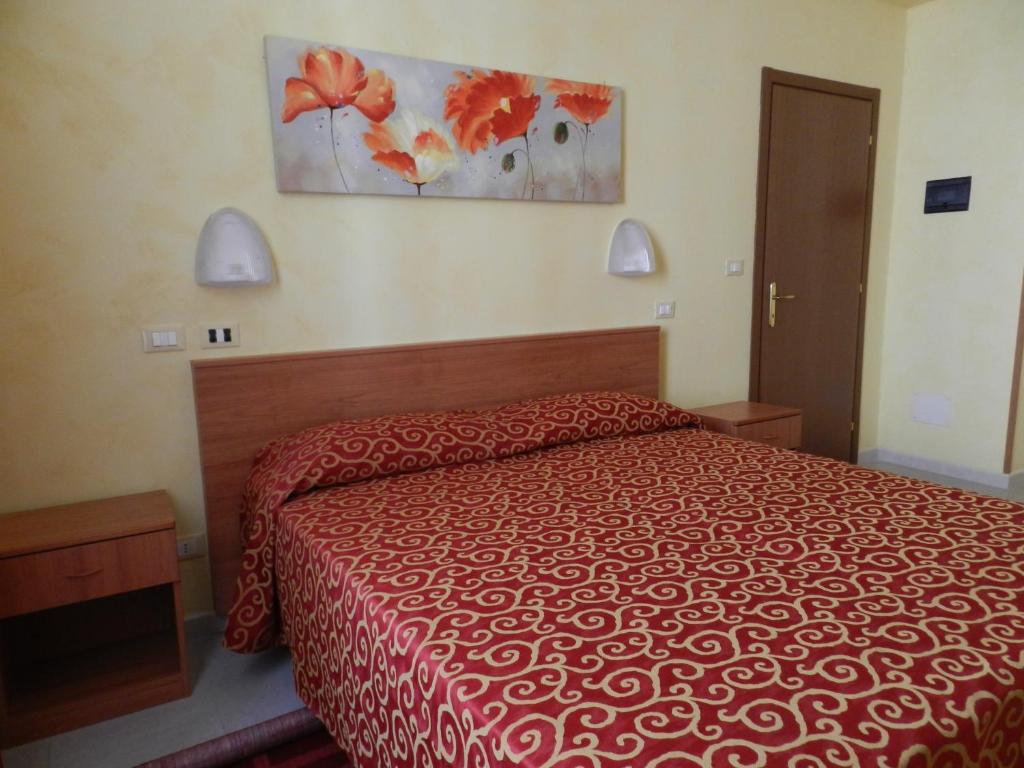 A bed or beds in a room at Hotel Air Palace Lingotto