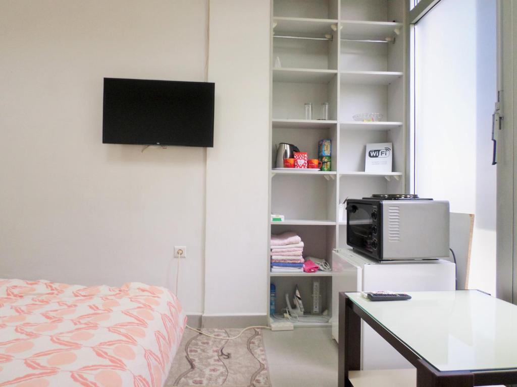 Televiisor ja/või meelelahutuskeskus majutusasutuses Soba Centar