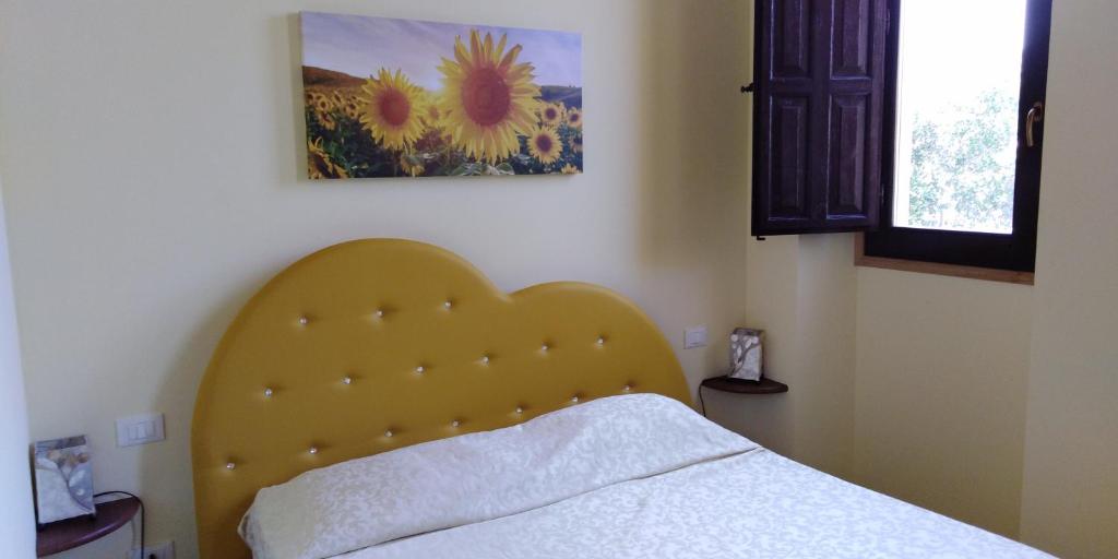 Łóżko lub łóżka w pokoju w obiekcie Villa le Torri B&B