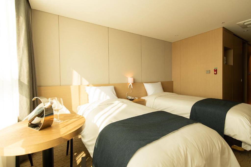 Postel nebo postele na pokoji v ubytování Hotel Winstory