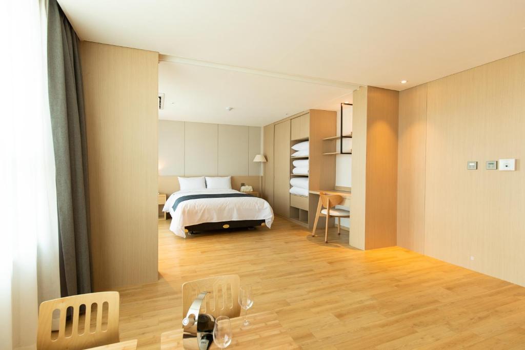 Postel nebo postele na pokoji v ubytování Hotel Winstory