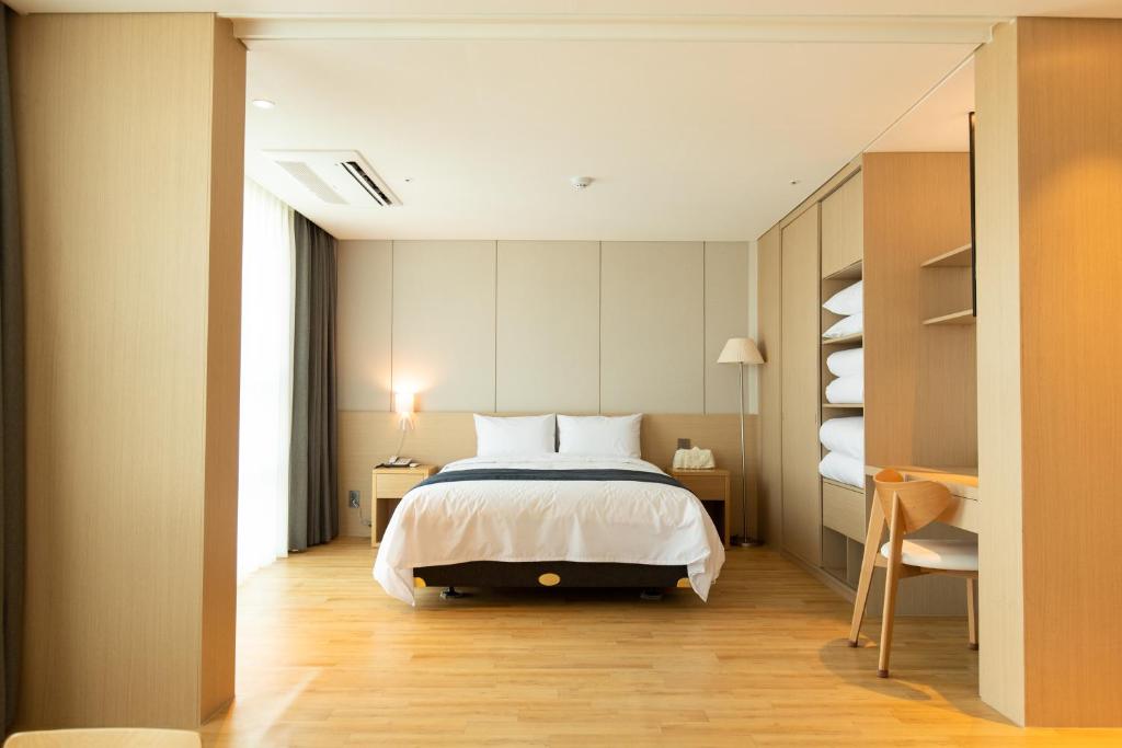Postel nebo postele na pokoji v ubytování Hotel Winstory