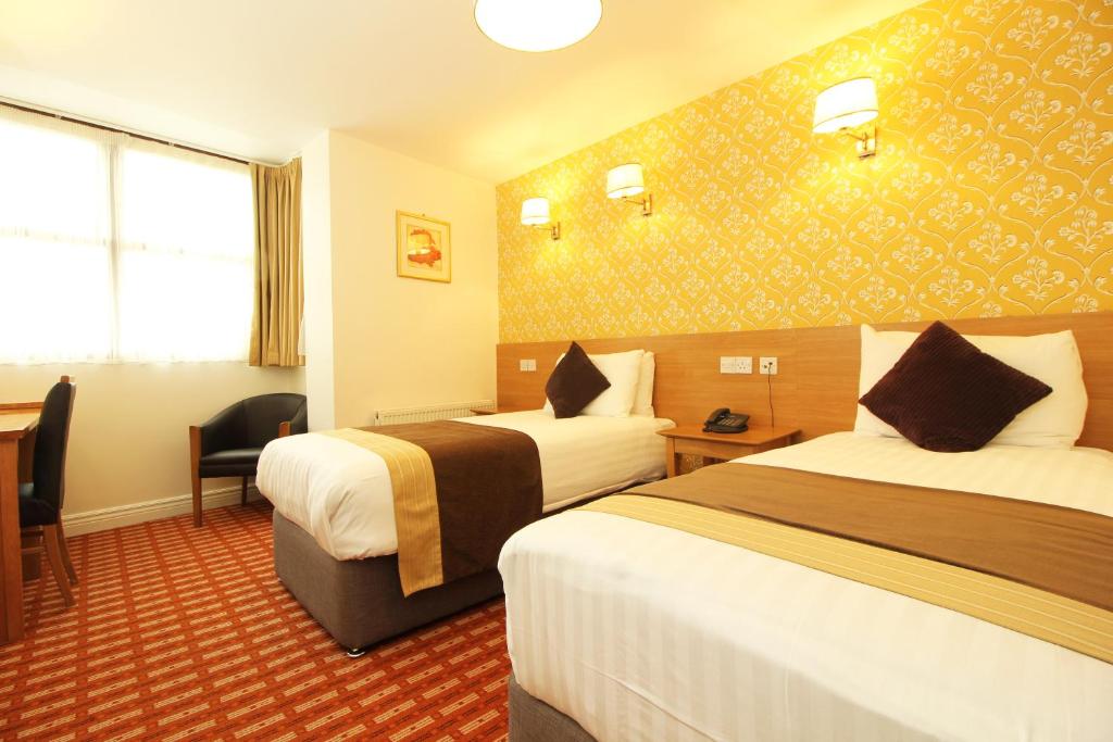 Postel nebo postele na pokoji v ubytování Castle Hotel