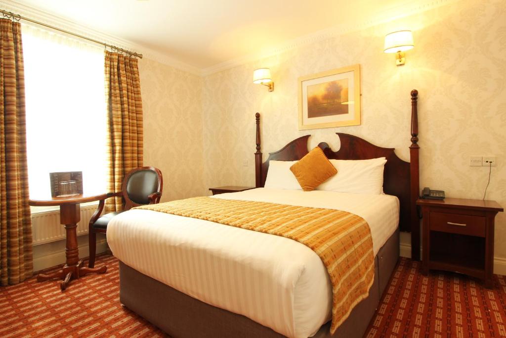 Postel nebo postele na pokoji v ubytování Castle Hotel