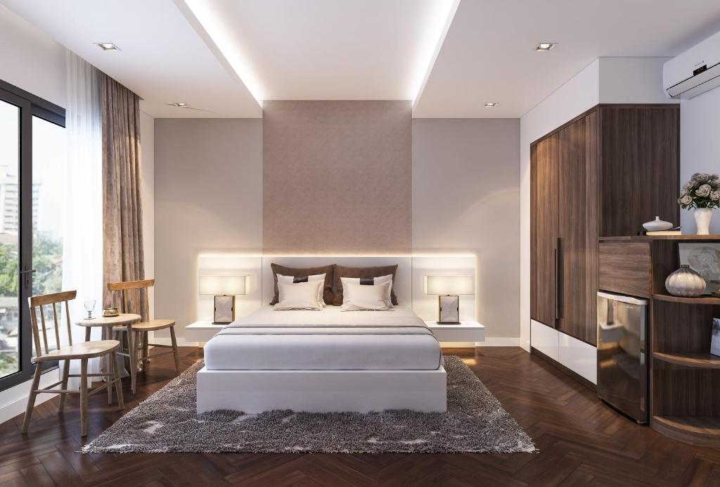 Giường trong phòng chung tại HA NOI HOTEL near Tan Son Nhat Airport --- FREE Airport Pick-Up and Drop-Off Available 24 Hours a Day