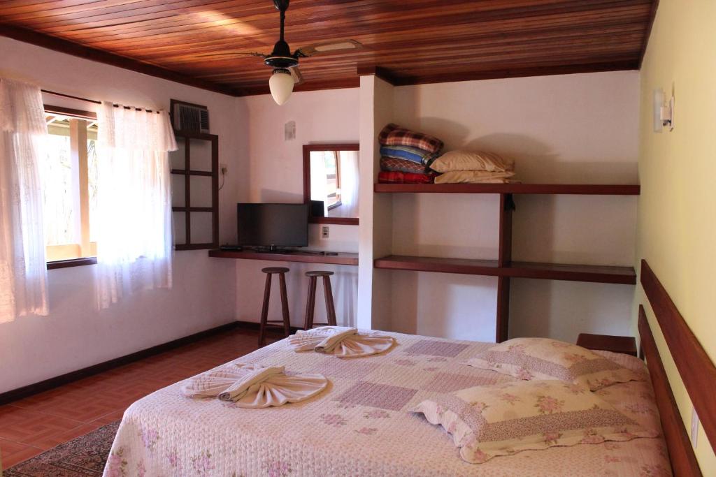 Postel nebo postele na pokoji v ubytování Pousada Flor de Paraty