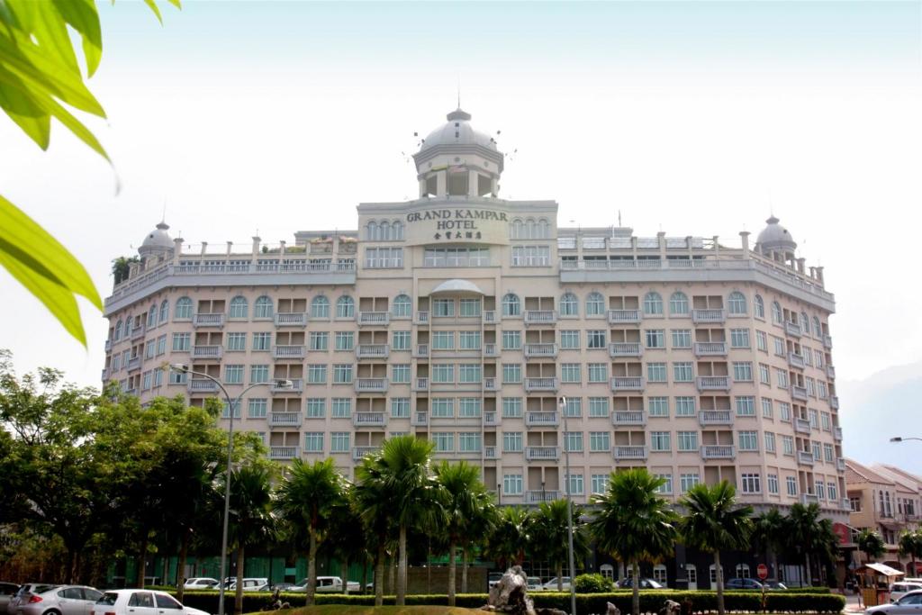 a large building with a tower on top of it at Grand Kampar Hotel in Kampar