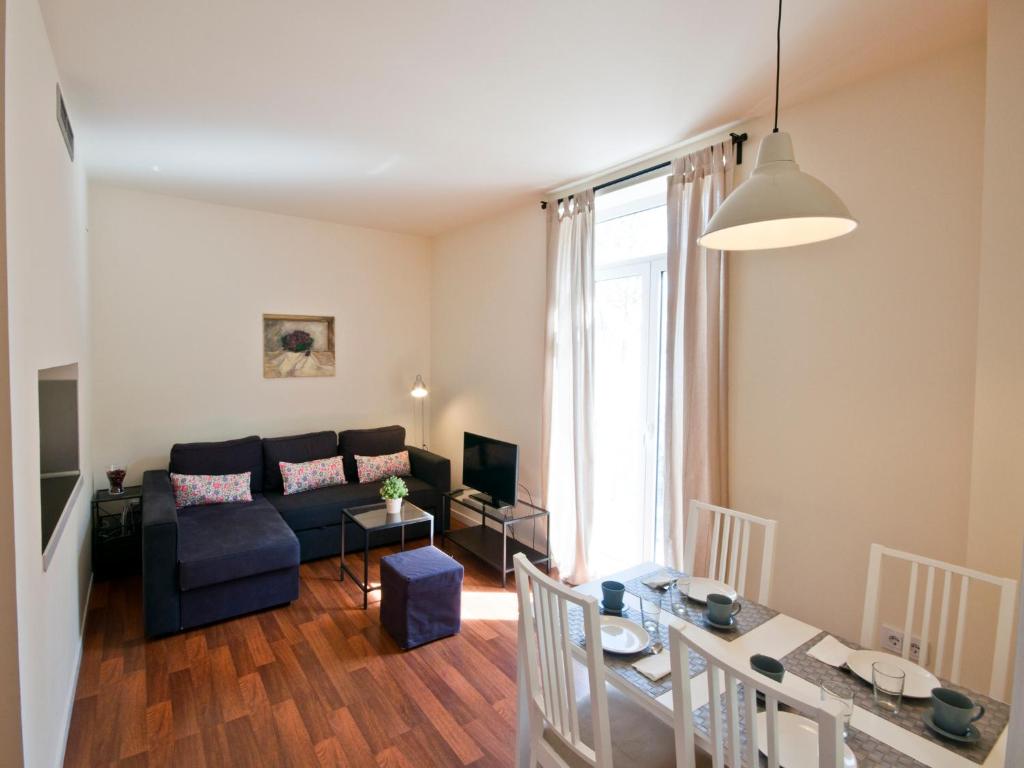 Posedenie v ubytovaní Apartamentos Murallas de Sevilla
