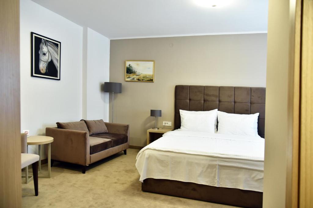 Postel nebo postele na pokoji v ubytování Miznah Hotels & Resorts