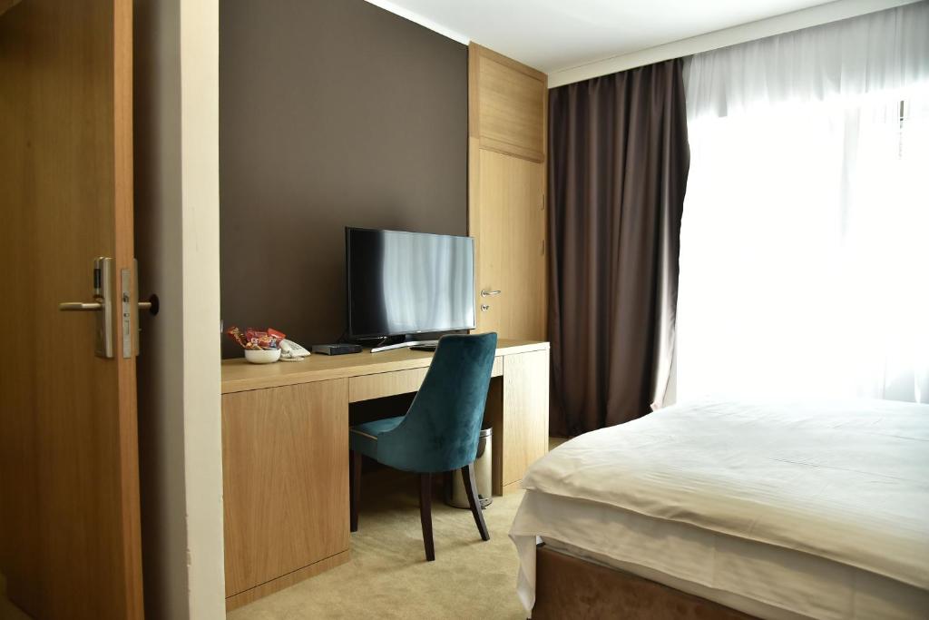 Postel nebo postele na pokoji v ubytování Miznah Hotels & Resorts