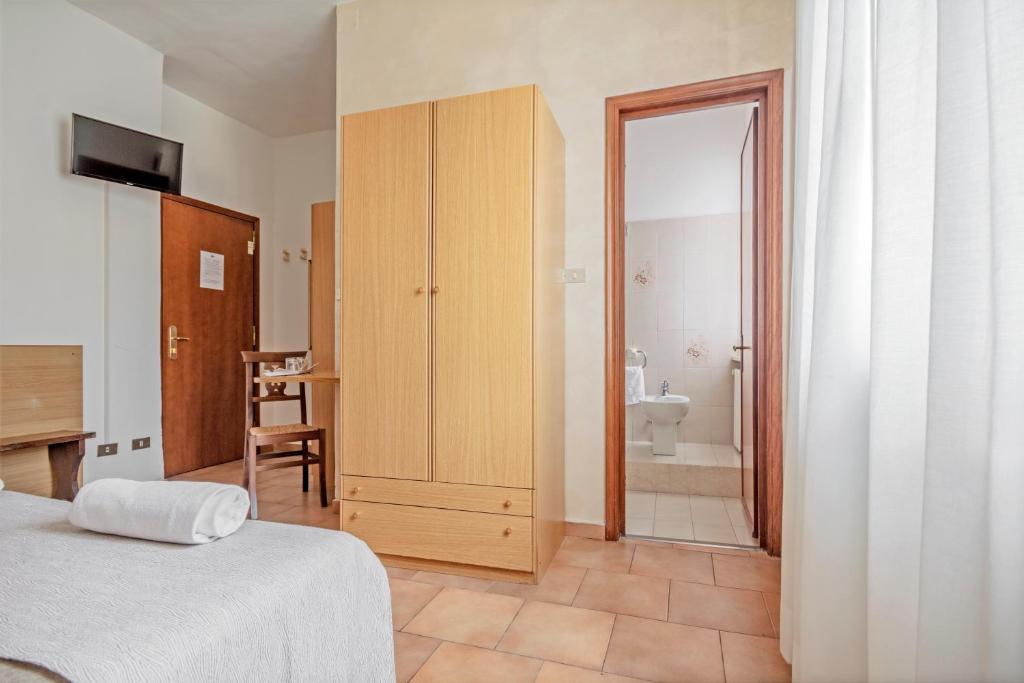 Postel nebo postele na pokoji v ubytování Albergo Rondò