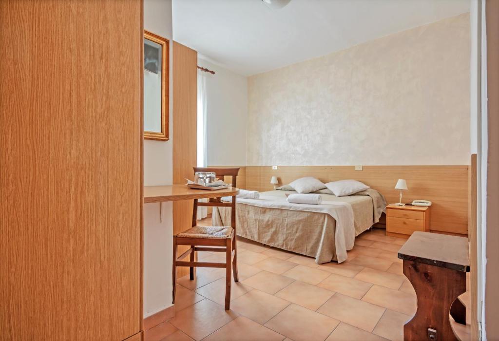 Postel nebo postele na pokoji v ubytování Albergo Rondò