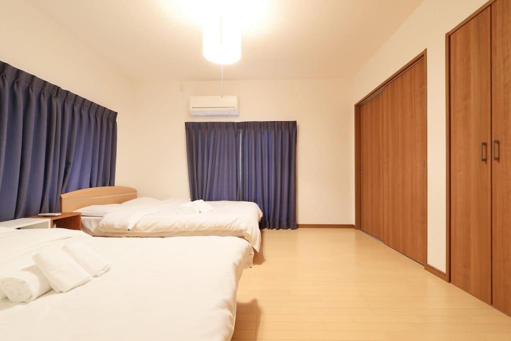 Voodi või voodid majutusasutuse Tokaichi inn 一軒家貸切 toas