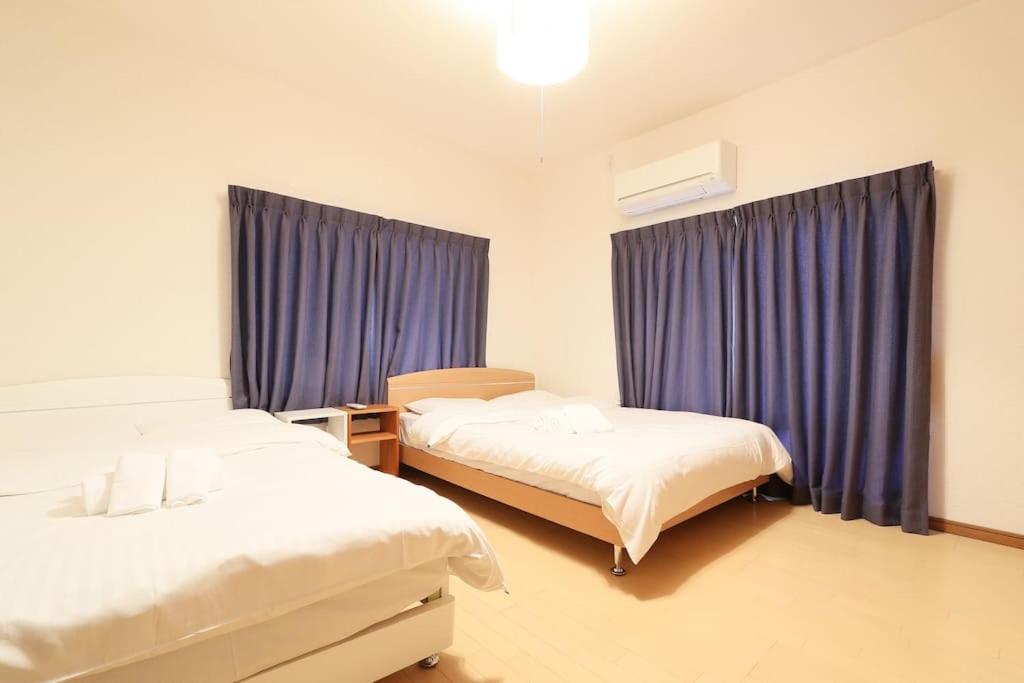 Voodi või voodid majutusasutuse Tokaichi inn 一軒家貸切 toas