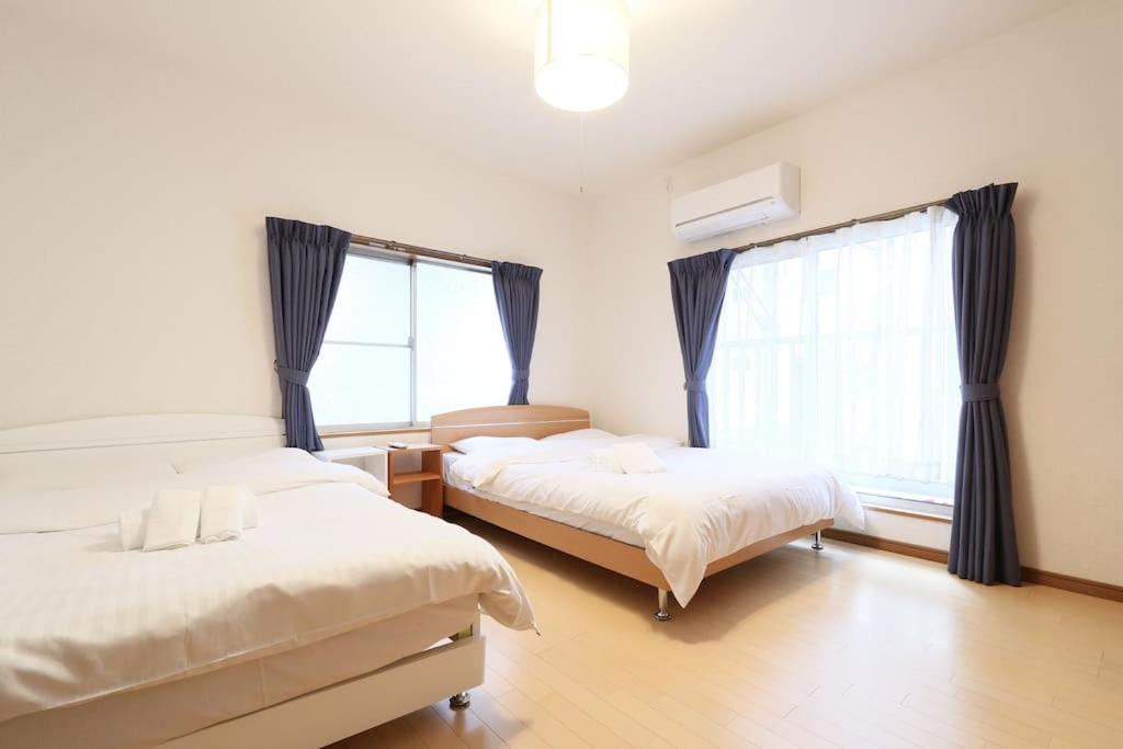 Voodi või voodid majutusasutuse Tokaichi inn 一軒家貸切 toas