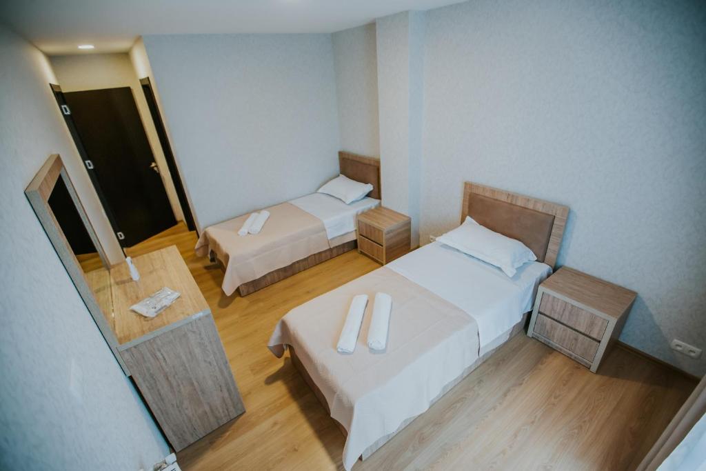 Postel nebo postele na pokoji v ubytování Sunset Telavi
