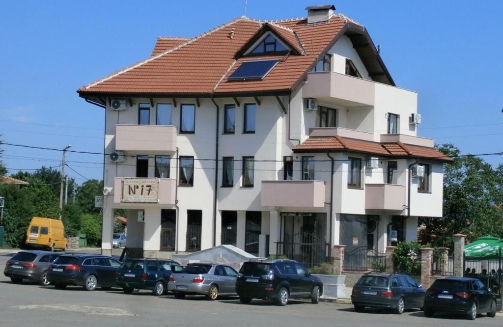 a building with cars parked in front of it at Aleksandrovo Apartments in Aleksandrovo