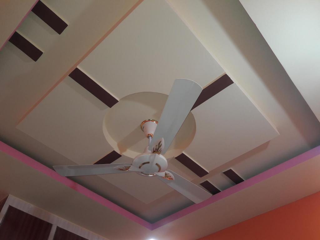 a ceiling fan sitting on a ceiling at Rks Homestay in Hampi
