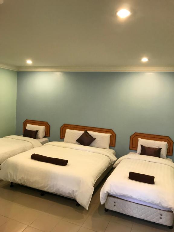 Postel nebo postele na pokoji v ubytování Hotel dan Restoran Seri Kangsar